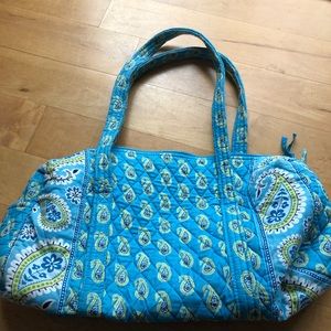 Iconic small duffel in blue and green tones